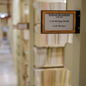 A sign marks where the federal documents are in the J.D. Williams Library