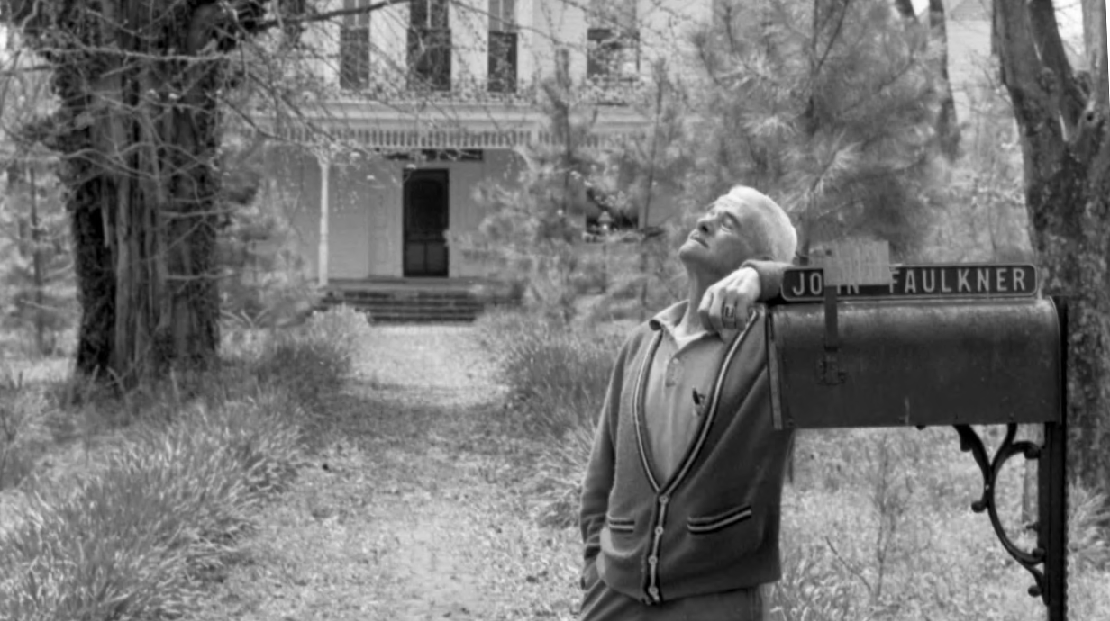 John Faulkner standing by a mailbox outside his house