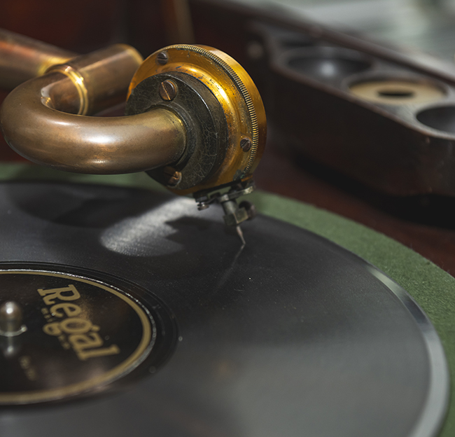 A black record spins on the vintage record player in the Blues Archive of J.D. Williams Library.