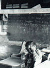 Black and white photo child in classroom