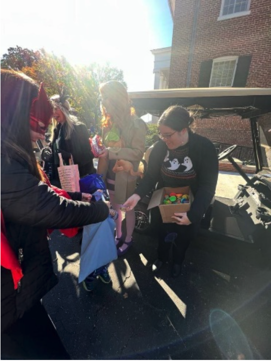 Staff Passing out Candy to Willie Price Students